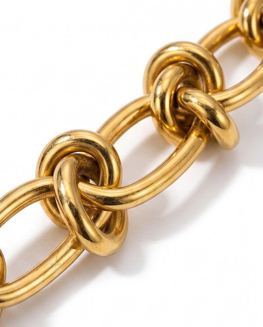 Ennvy Accessories Poised Bracelet, gold-plated stainless steel with structured link and knot detailing.