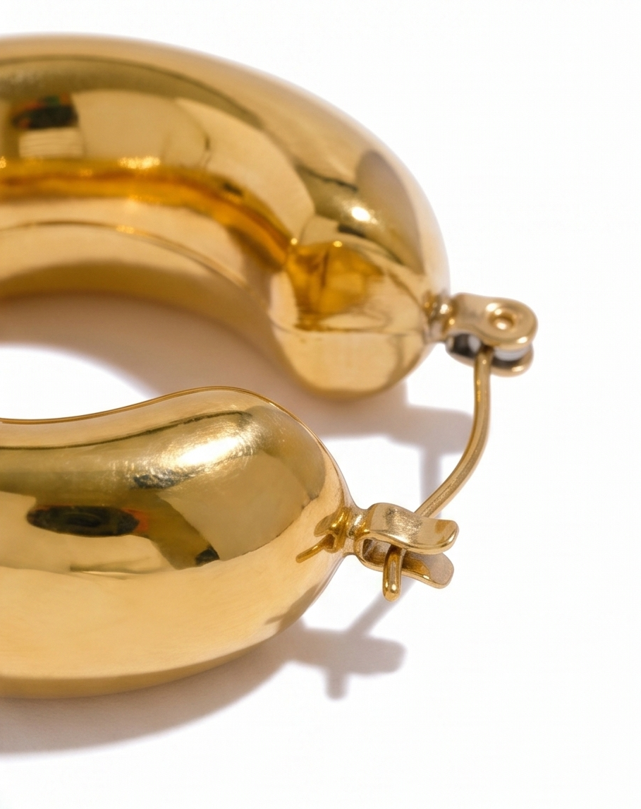 Gold hoop earrings on a white background