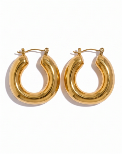Gold hoop earrings on a white background