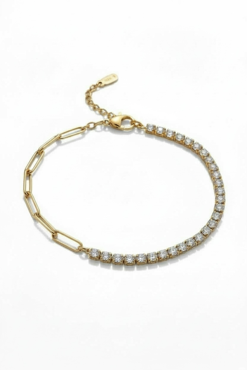 Gold bracelet with diamond accents on a white background