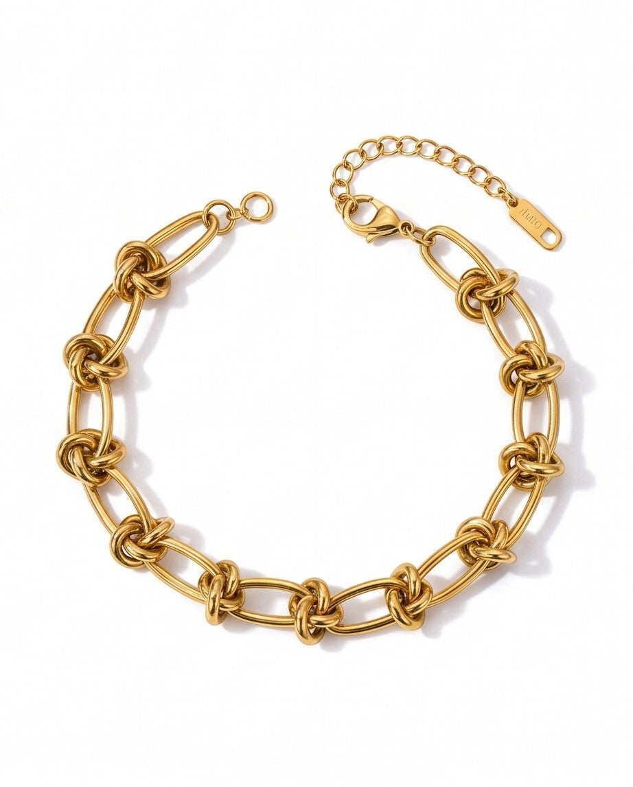 Ennvy Accessories Poised Bracelet: gold-plated stainless steel chain with knot detailing and lobster clasp.