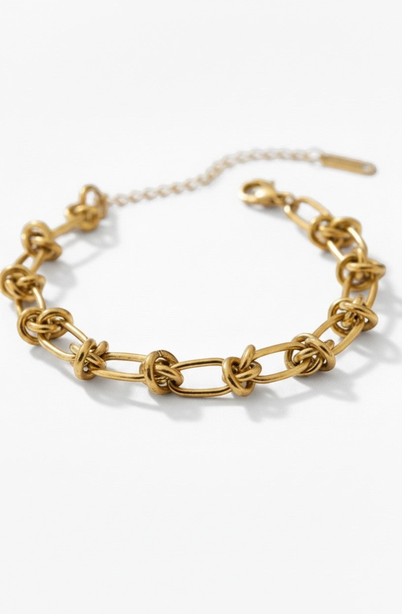 Ennvy Accessories Poised Bracelet: gold-plated stainless steel chain with knot detailing and lobster clasp.