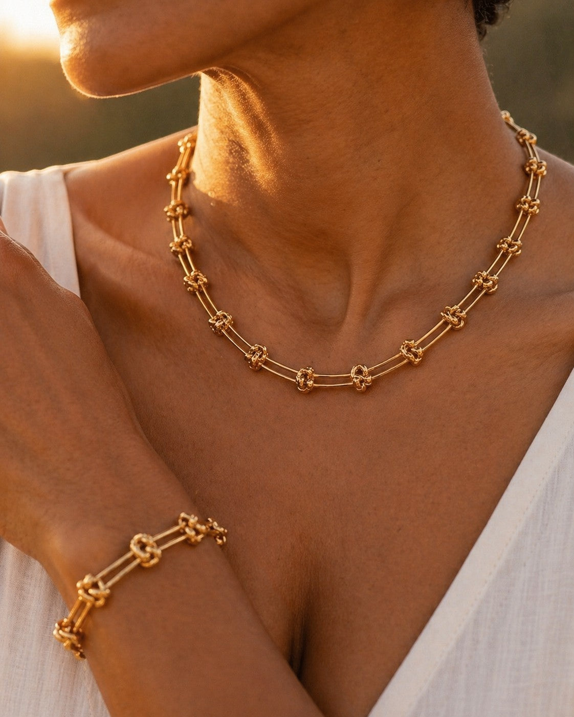 Ennvy Accessories Poised Bracelet, a gold-plated stainless steel bracelet with structured links and knot detailing.